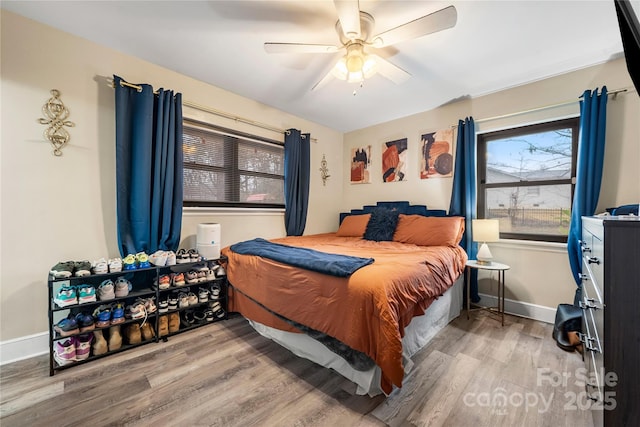 bedroom featuring hardwood / wood-style floors and ceiling fan