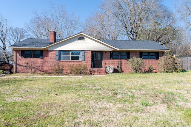 ranch-style home featuring a front lawn, fence, brick siding, and a chimney