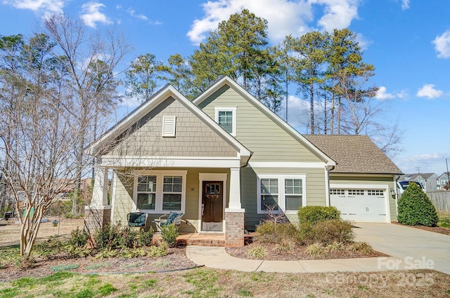 view of front of house with a porch and a garage