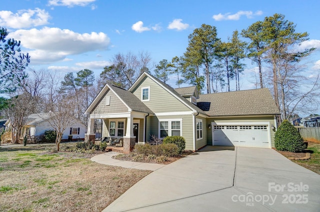 view of front of home with covered porch and a garage