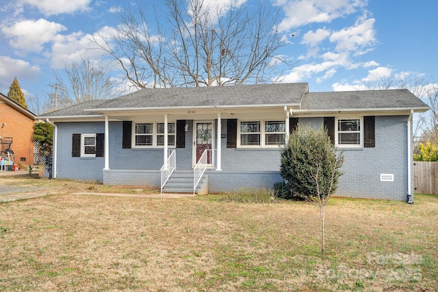 single story home featuring a front yard