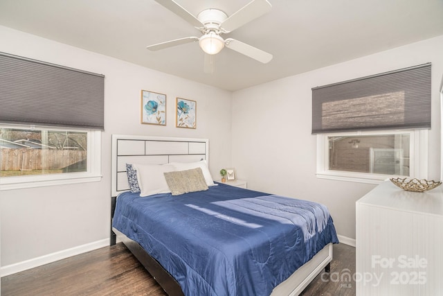 bedroom featuring dark hardwood / wood-style flooring and ceiling fan