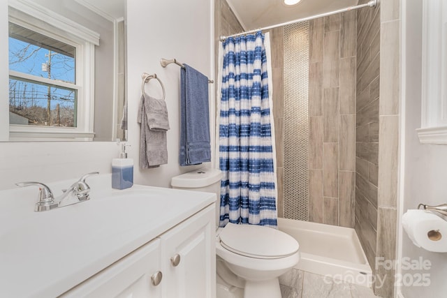 bathroom with vanity, toilet, and curtained shower