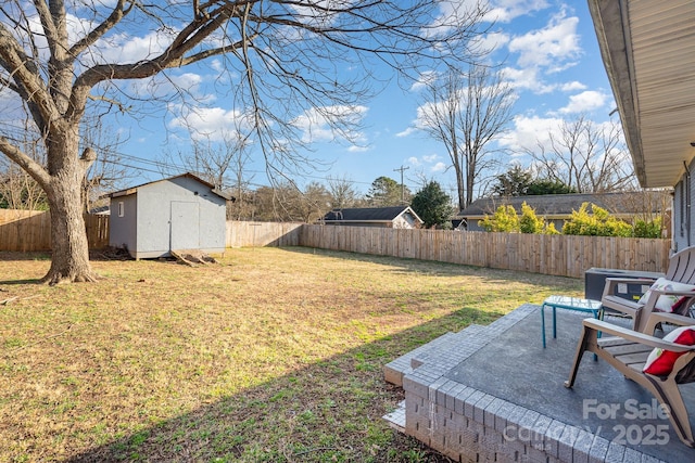 view of yard featuring a storage shed and a patio area