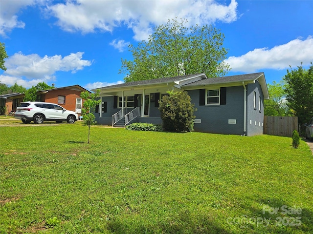 4930 Crestmont Dr, Charlotte, NC 28205 - single story home with covered porch, crawl space, fence, a front lawn, and brick siding