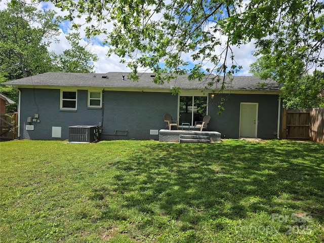 4930 Crestmont Dr, Charlotte, NC 28205 - rear view of property with cooling unit, brick siding, a yard, and fence
