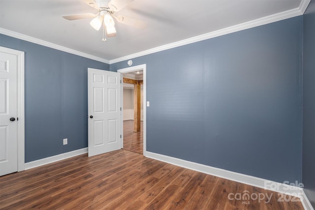 unfurnished room featuring a ceiling fan, baseboards, ornamental molding, and wood finished floors