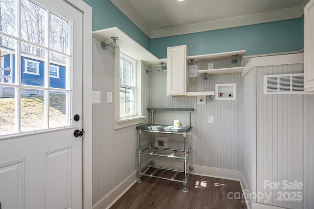 clothes washing area featuring hookup for a washing machine, hookup for an electric dryer, laundry area, baseboards, and dark wood-style floors