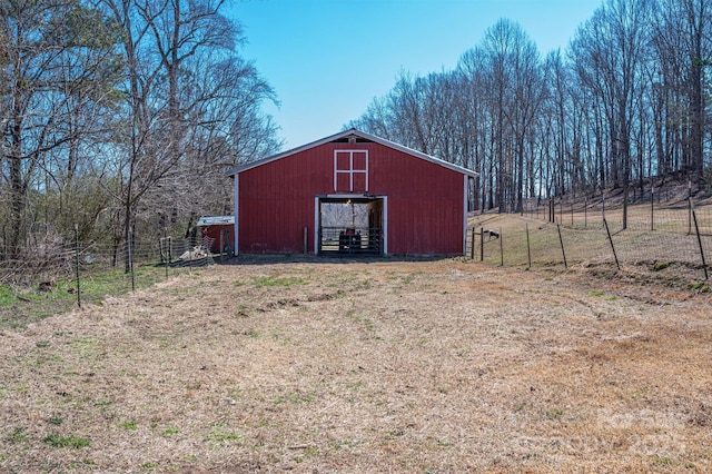 view of outdoor structure with fence and an outdoor structure