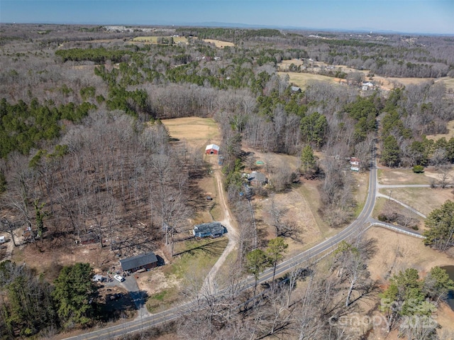 aerial view featuring a rural view and a view of trees