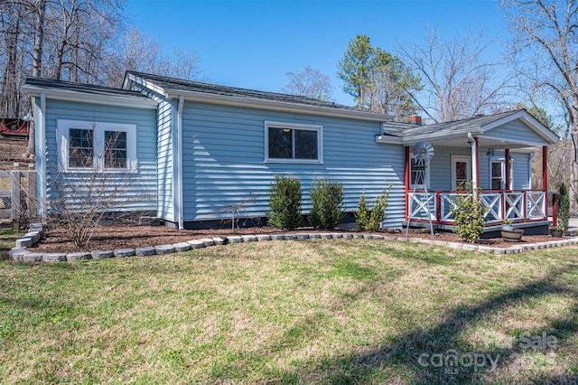 ranch-style house with a porch and a front yard