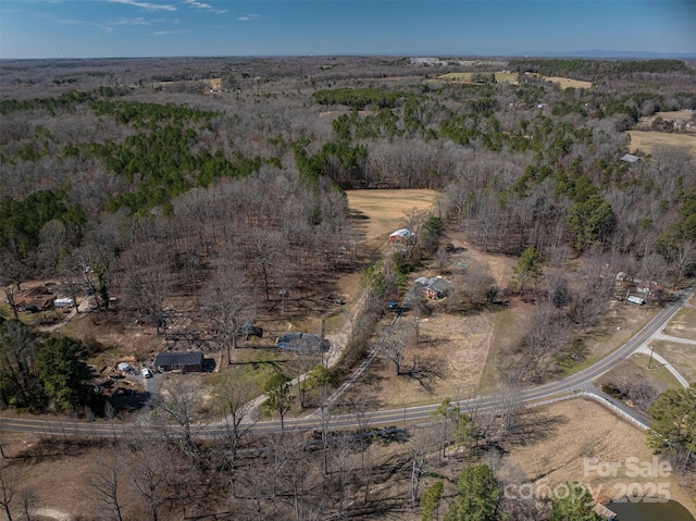 drone / aerial view featuring a forest view and a rural view