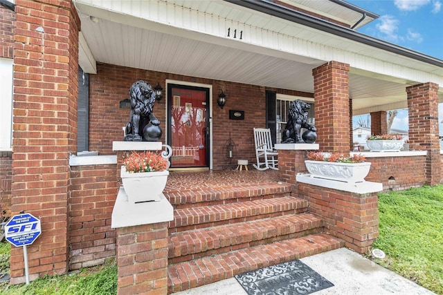 property entrance featuring a porch