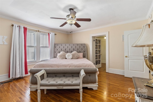 bedroom featuring crown molding and wood-type flooring