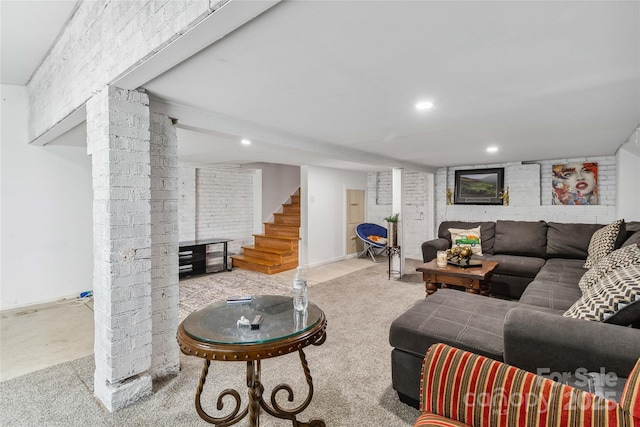 living room with brick wall and light colored carpet