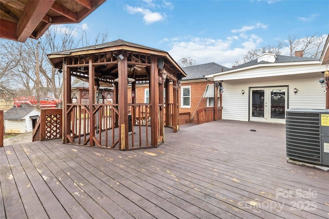 deck featuring central air condition unit and french doors