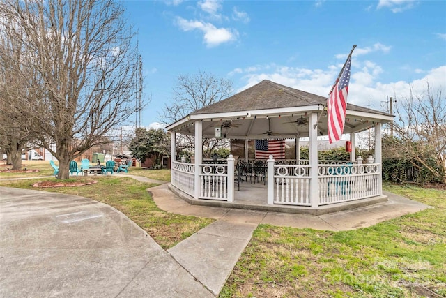 exterior space featuring a gazebo, a patio, and a lawn