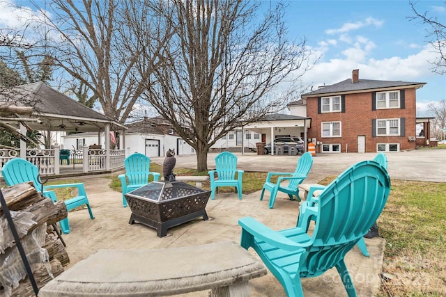 view of patio with a gazebo and an outdoor fire pit