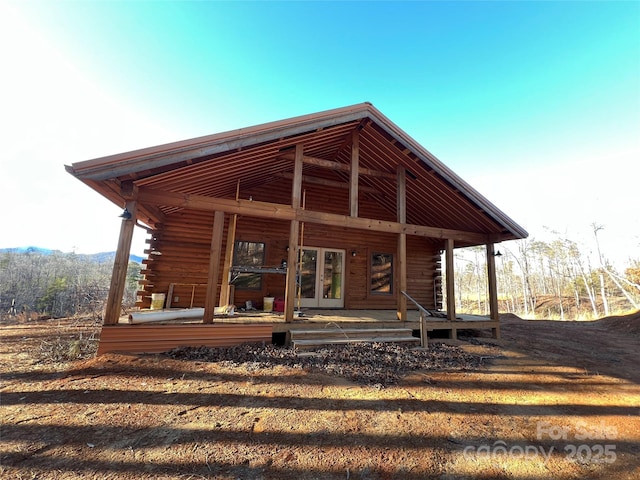 back of property featuring a porch