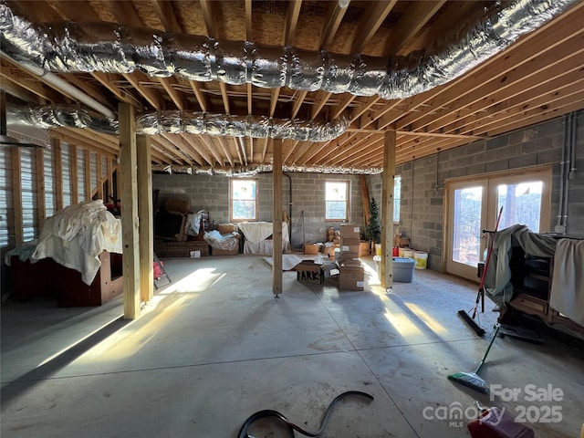 misc room featuring plenty of natural light and concrete floors