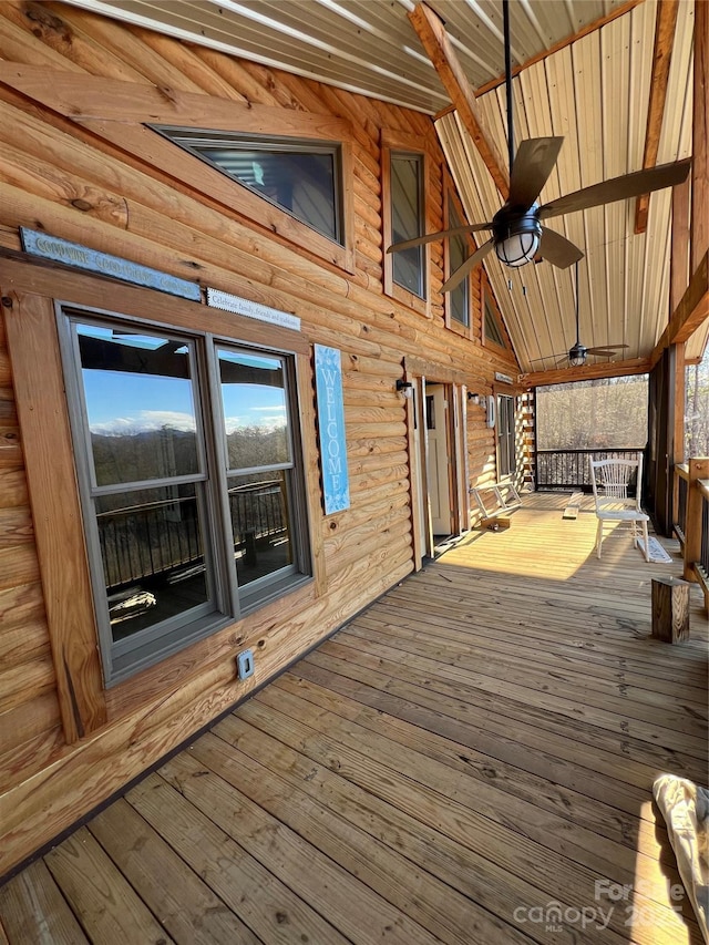 wooden deck featuring ceiling fan and a porch