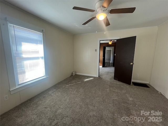 unfurnished room with carpet floors and ornamental molding