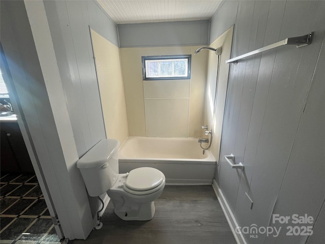 bathroom featuring shower / bath combination, wood-type flooring, and toilet