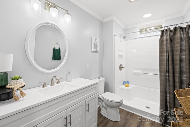 bathroom with crown molding, wood-type flooring, curtained shower, and toilet