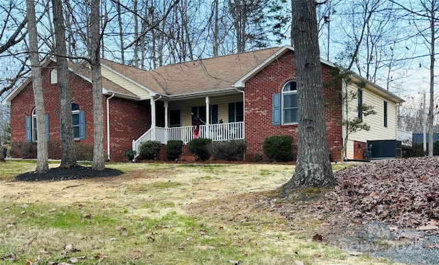 single story home with covered porch and brick siding