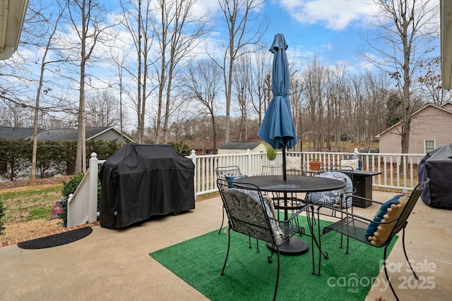 view of patio with a deck, grilling area, and outdoor dining space