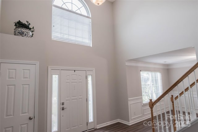 2043 Covered Bridge Ct, Rock Hill, SC 29732 - foyer featuring stairway, crown molding, a towering ceiling, dark wood-style flooring, and wainscoting
