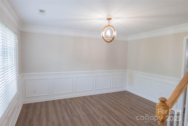 2043 Covered Bridge Ct, Rock Hill, SC 29732 - spare room with a chandelier, ornamental molding, dark wood finished floors, wainscoting, and a decorative wall