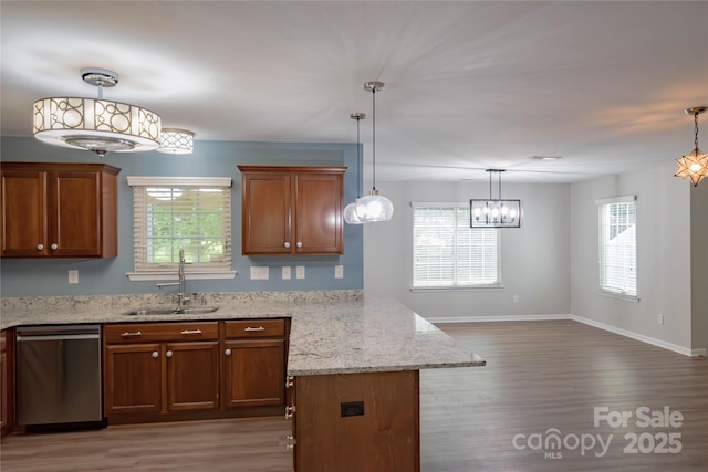 2043 Covered Bridge Ct, Rock Hill, SC 29732 - kitchen featuring dishwasher, a sink, a chandelier, and light wood-type flooring