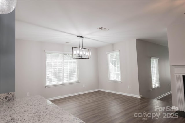 2043 Covered Bridge Ct, Rock Hill, SC 29732 - unfurnished dining area with healthy amount of natural light, dark wood-style floors, and a chandelier