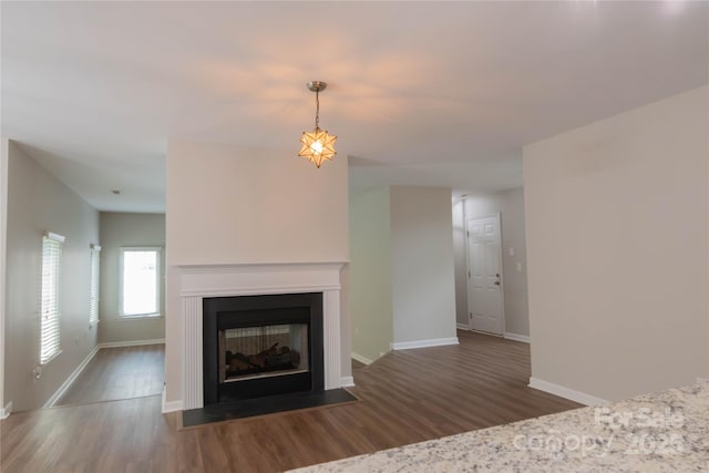 2043 Covered Bridge Ct, Rock Hill, SC 29732 - unfurnished living room featuring wood finished floors, baseboards, and a multi sided fireplace