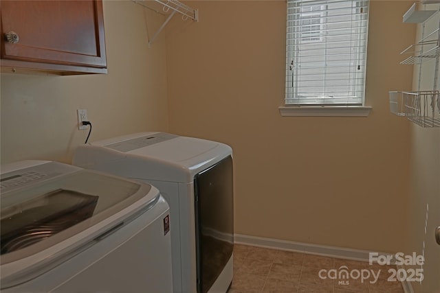 2043 Covered Bridge Ct, Rock Hill, SC 29732 - laundry area featuring washer and dryer, cabinet space, baseboards, and light tile patterned flooring