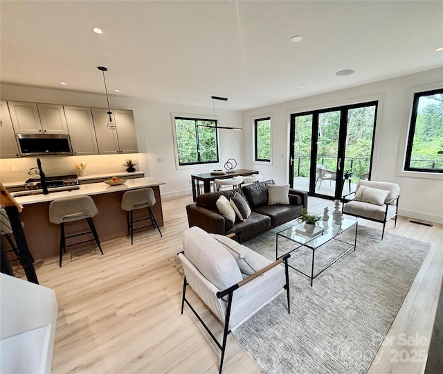 5 Dale St, Asheville, NC 28806 - living area with light wood-type flooring, baseboards, and recessed lighting