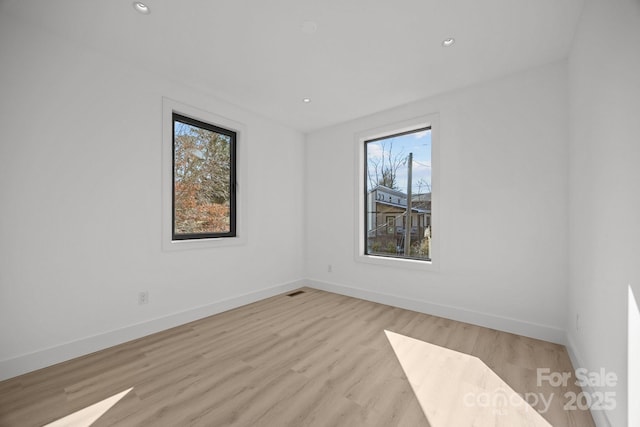 5 Dale St, Asheville, NC 28806 - spare room with plenty of natural light, light wood-type flooring, baseboards, and recessed lighting