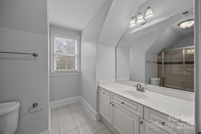 bathroom featuring toilet, vanity, baseboards, and vaulted ceiling