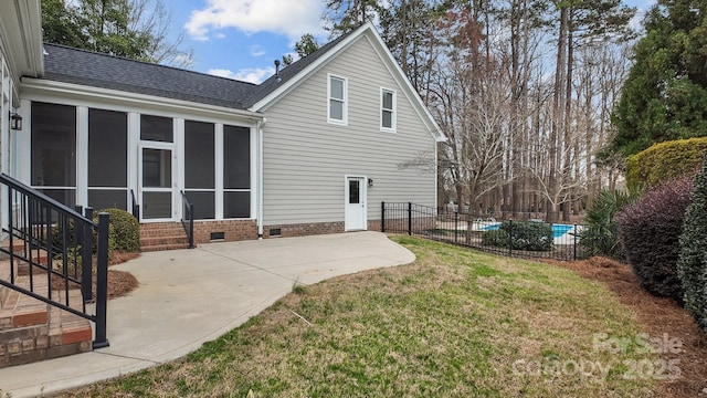 back of house featuring a patio, fence, a yard, a sunroom, and crawl space