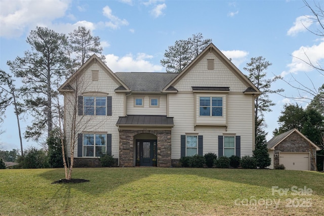 craftsman house with a garage, a standing seam roof, metal roof, and a front lawn