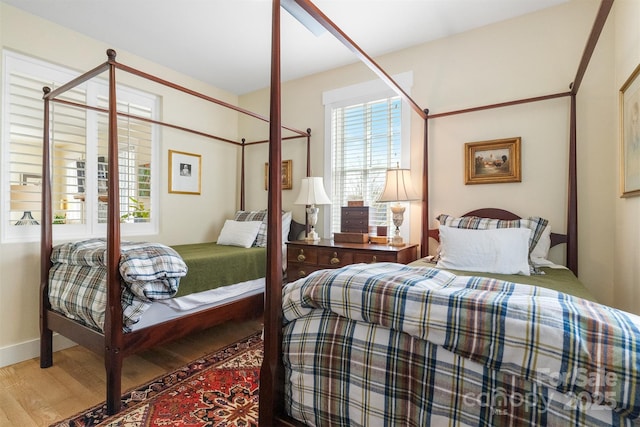 bedroom featuring wood-type flooring