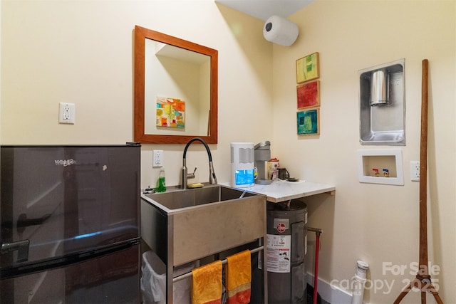 bathroom featuring sink and electric water heater