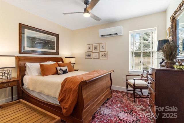 bedroom with a wall mounted air conditioner and ceiling fan