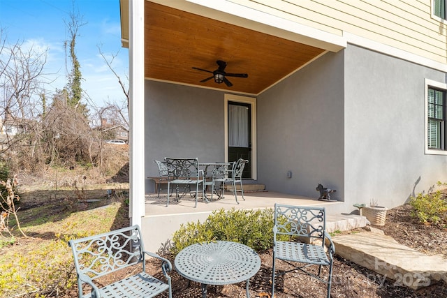 view of patio featuring ceiling fan