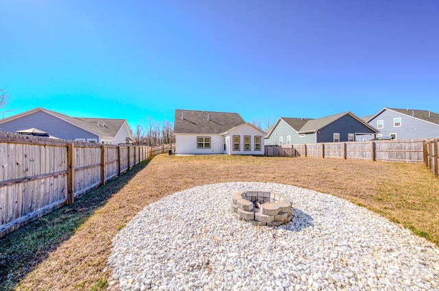 view of yard with an outdoor fire pit