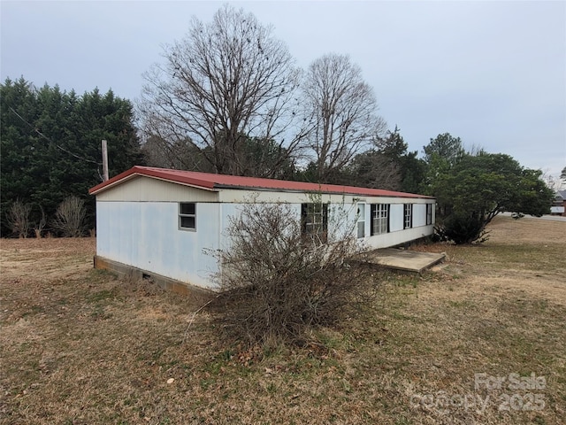 exterior space featuring a front lawn