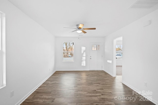 interior space with ceiling fan and dark hardwood / wood-style floors