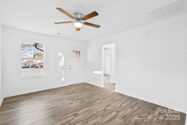 unfurnished room featuring hardwood / wood-style floors and ceiling fan