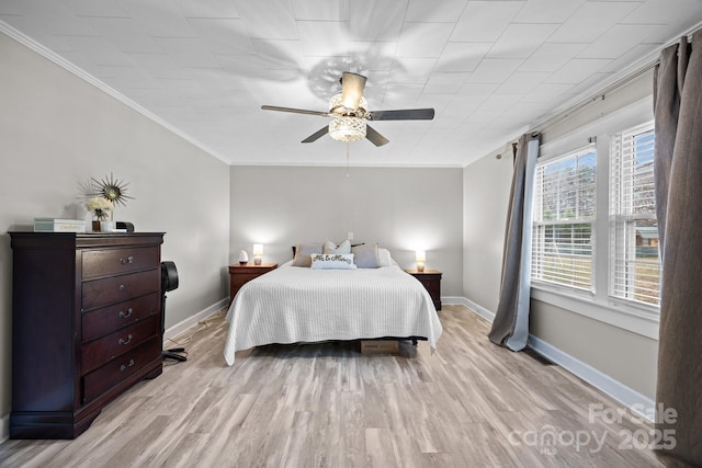 bedroom featuring ceiling fan, ornamental molding, and light hardwood / wood-style floors